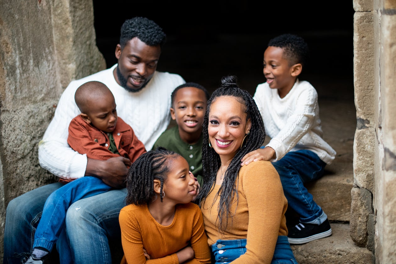 A family smiling together at home